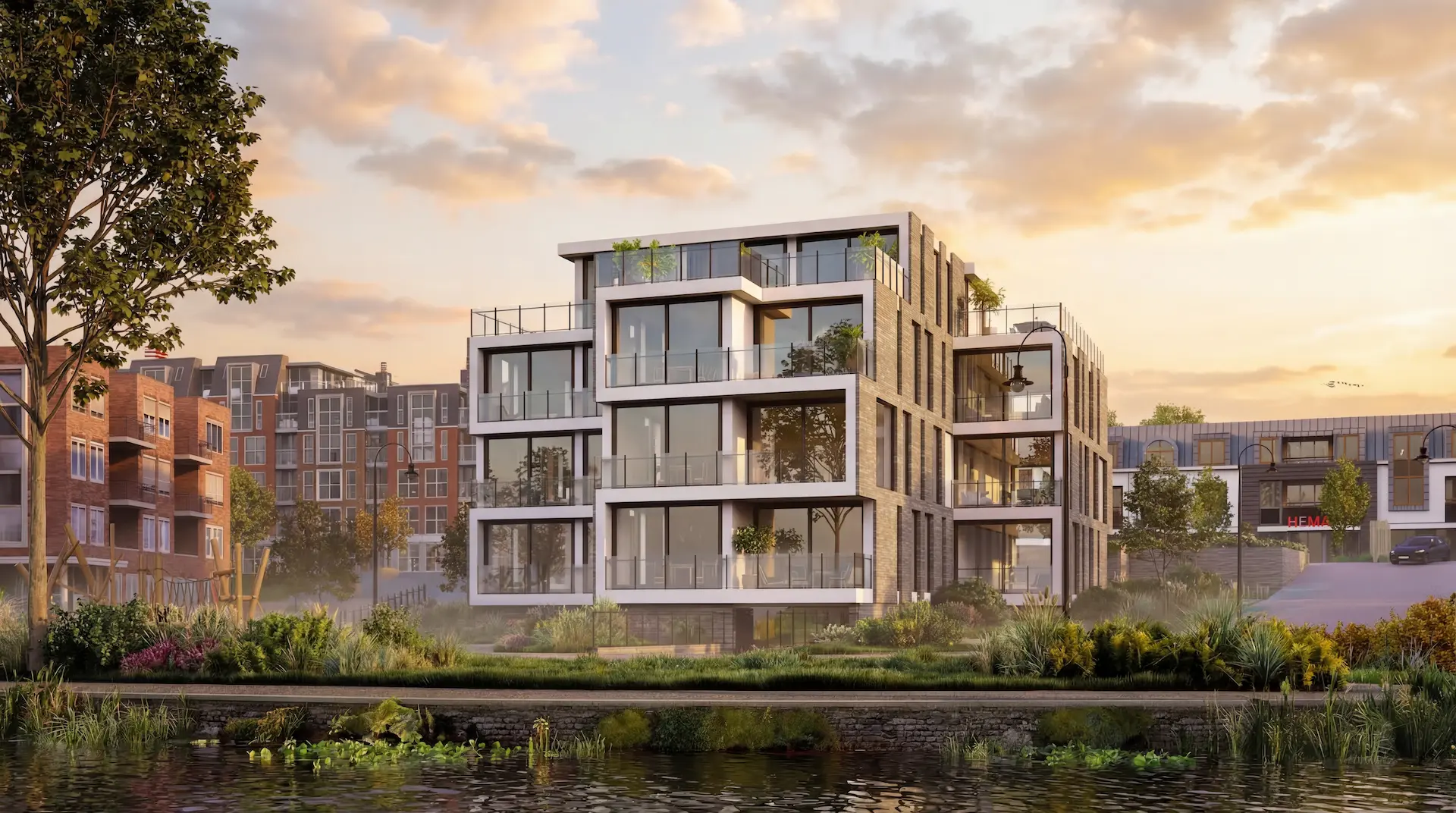 Modern appartementengebouw aan het water met grote glaspartijen, terrassen en strakke architectuur in een stedelijke omgeving.