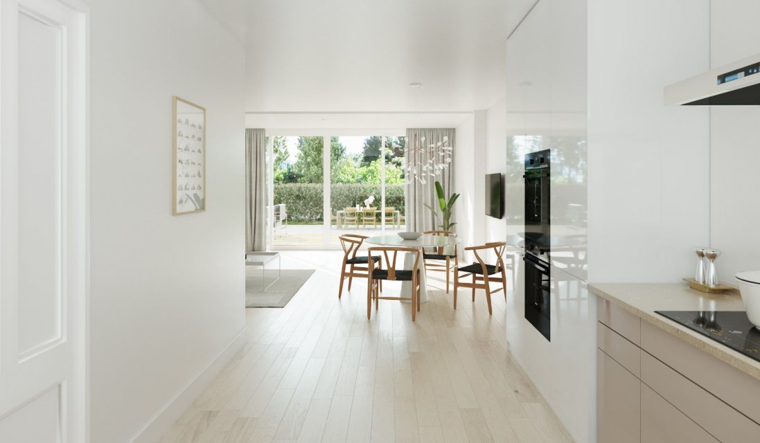 Doorkijk van keuken naar eetruimte met tuinzicht &ndash; duurzaam renoveren met licht en zicht in architectuur door architect Oud-Alblas.